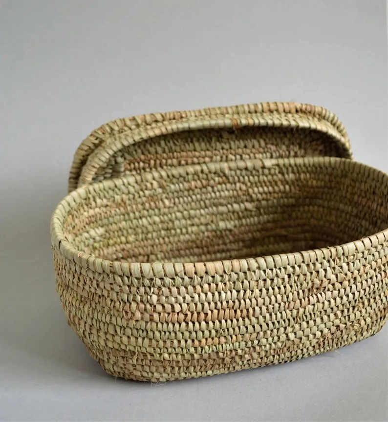 Small oval box for jewelry from palm leaves